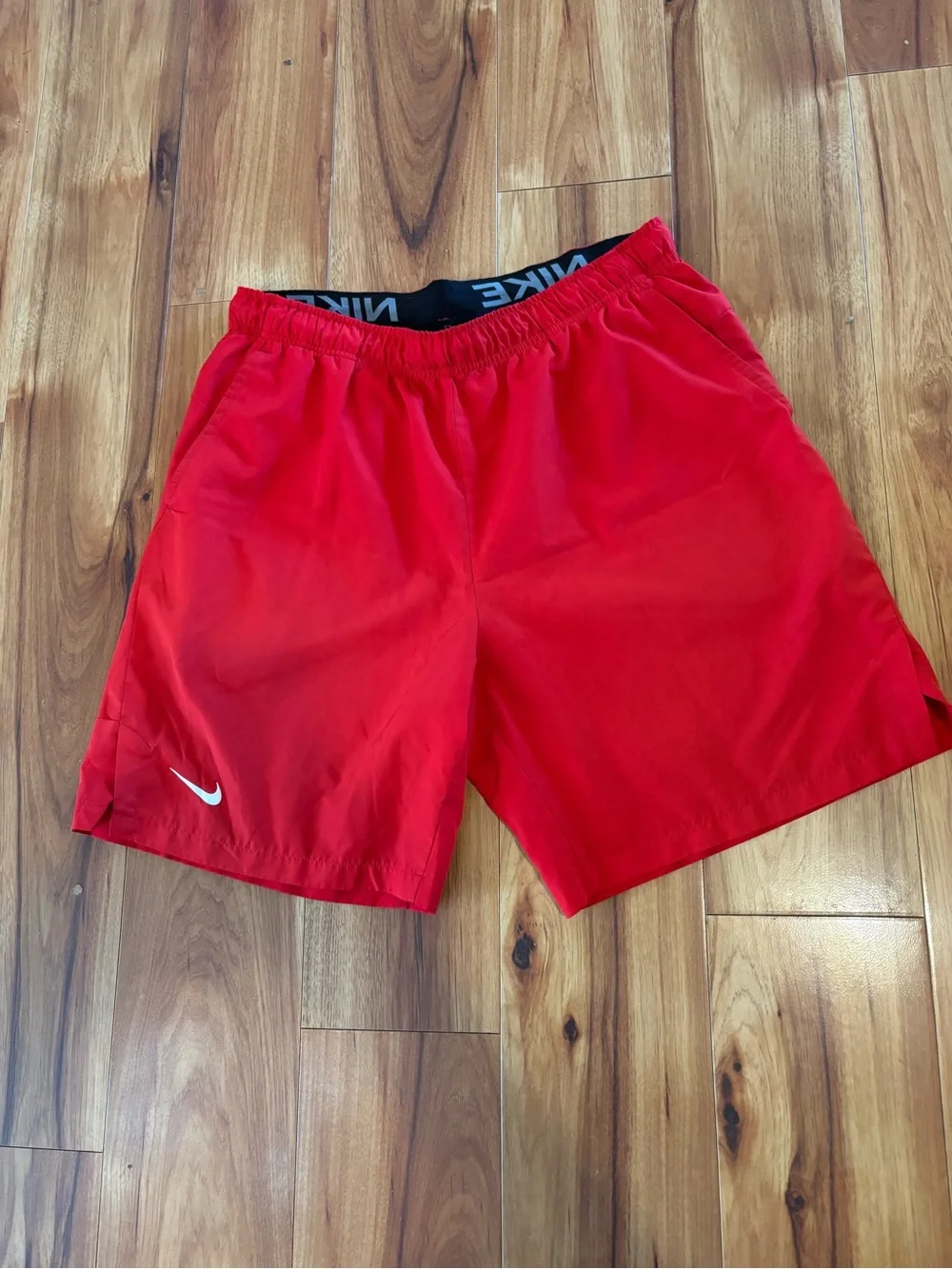 c-1 Nike Men’s Bright Red Athletic Shorts with White Swoosh.